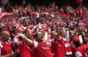Arsenal fans cheer during the English FA Cup final match between Arsenal and Hull City at Wembly Stadium in London on May 17, 2014. AFP PHOTO/ADRIAN DENNIS NOT FOR MARKETING OR ADVERTISING USE / RESTRICTED TO EDITORIAL USE (Photo credit should read ADRIAN DENNIS/AFP/Getty Images)