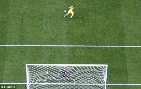 Romania's Bogdan Stancu scores a penalty to equalise past France keeper Hugo Lloris 
