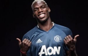 Done Deal: Paul Pogba pictured in a Manchester United shirt
