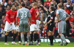 MANCHESTER, UNITED KINGDOM - MARCH 14:  Referee Alan Wiley shows a red card to Nemanja Vidic of Manchester United during the Barclays Premier League match between Manchester United and Liverpool at Old Trafford on March 14, 2009 in Manchester, England. (Photo by Laurence Griffiths/Getty Images)